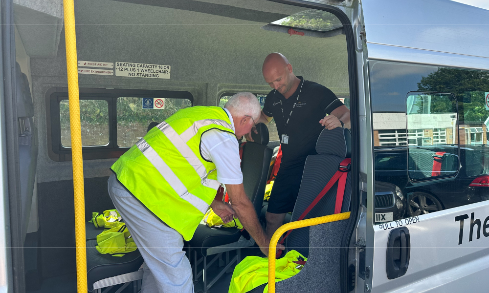 midas minibus driver training - trainee and instructor set up the equipment